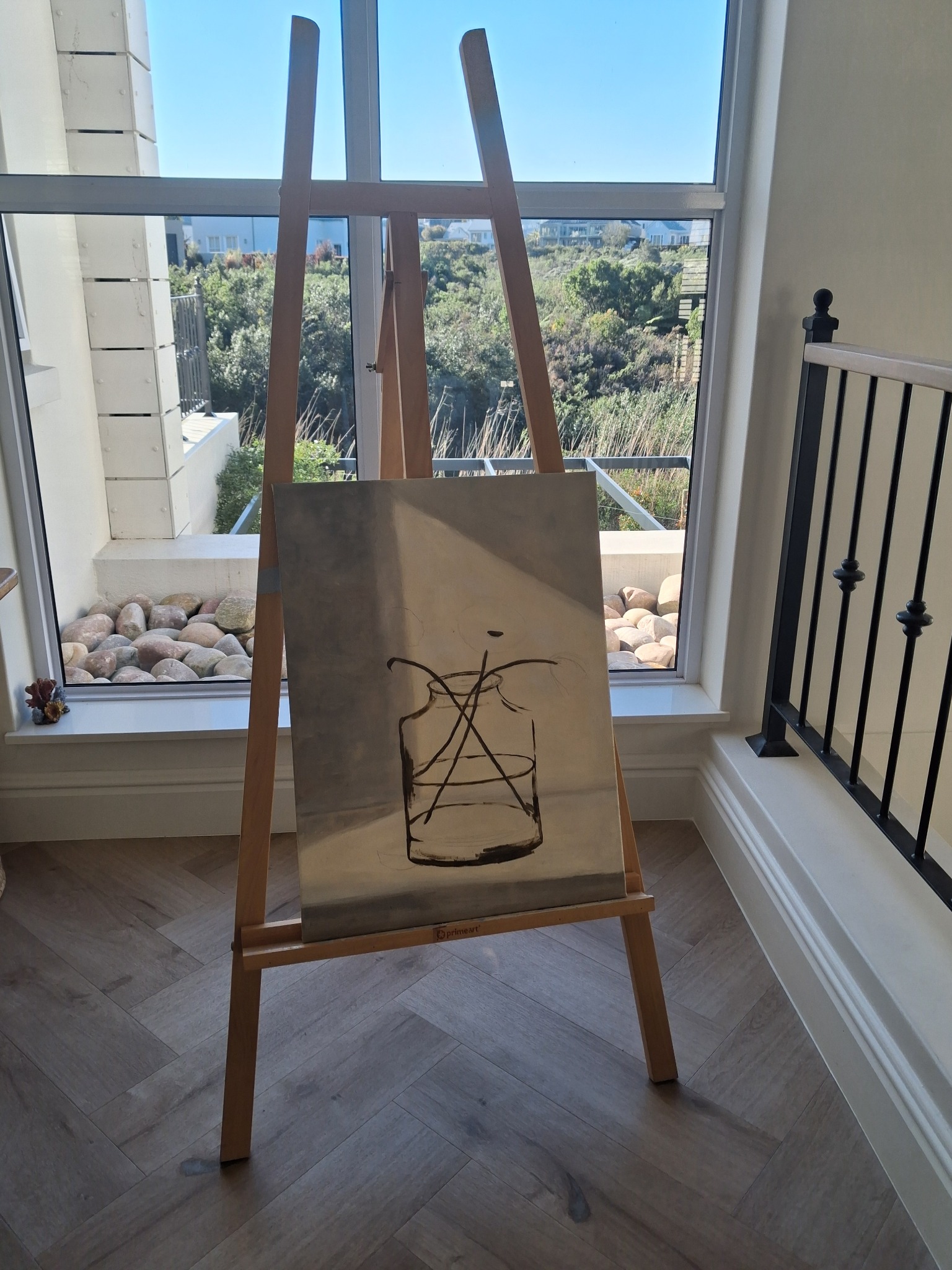 An unfinished vessel painting on Ilse's easel overlooking the Garden Route
